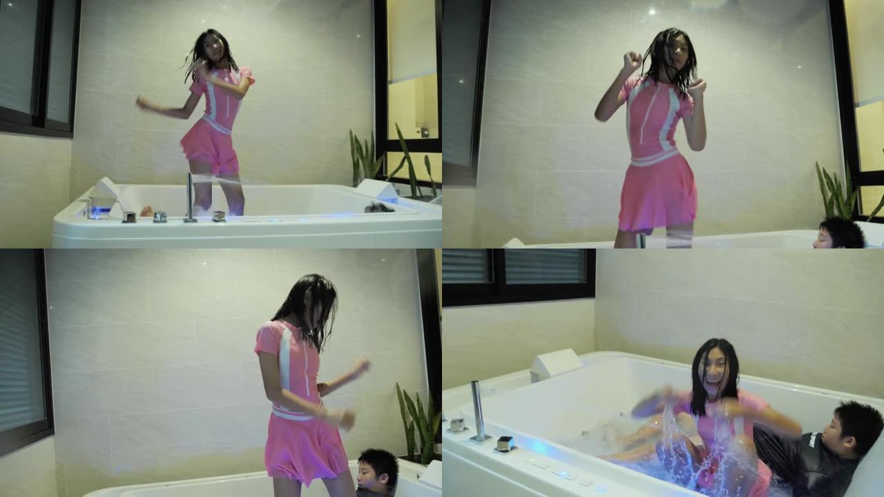 快乐的亚洲女孩在酒店的热浴缸里跳舞，与家人一起度假，生活方式理念。