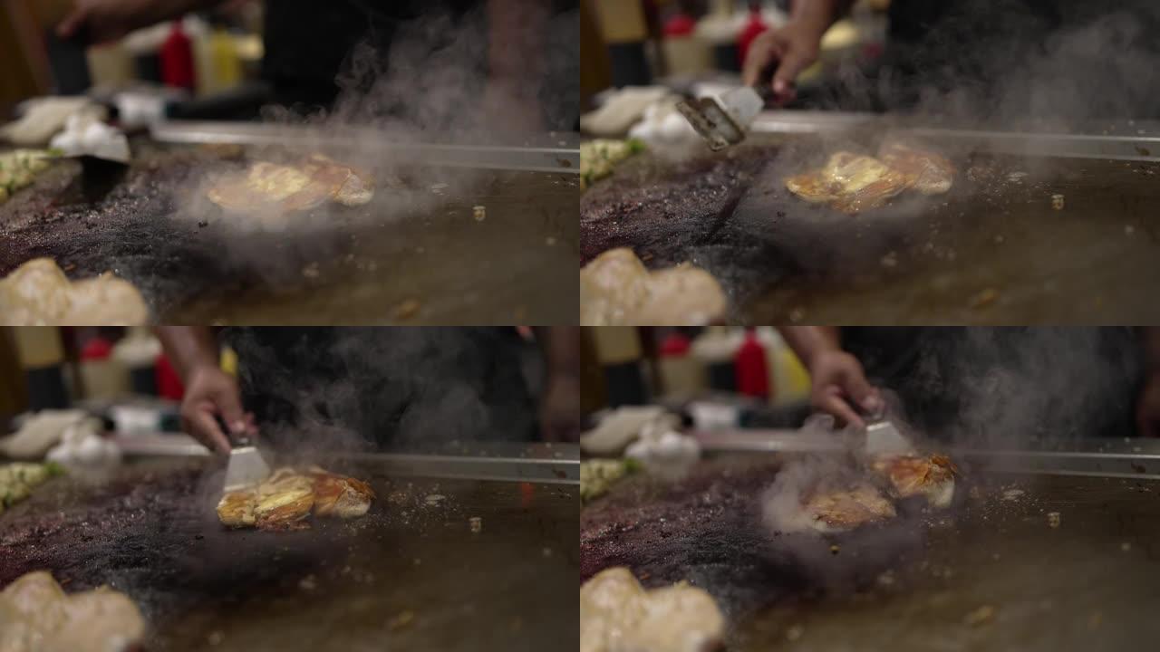 鱼片在热烤架上炒和翻转
