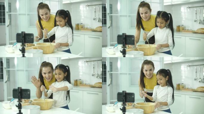 母女vloggers在家庭厨房拍摄和直播烘焙教程
