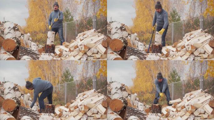 一个穿着蓝色毛衣和牛仔裤的男人在秋天的房子后院用斧头砍柴。伐木工人砍柴后会擦汗