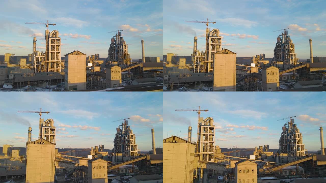 工业生产区高工厂结构水泥厂和塔式起重机的鸟瞰图。