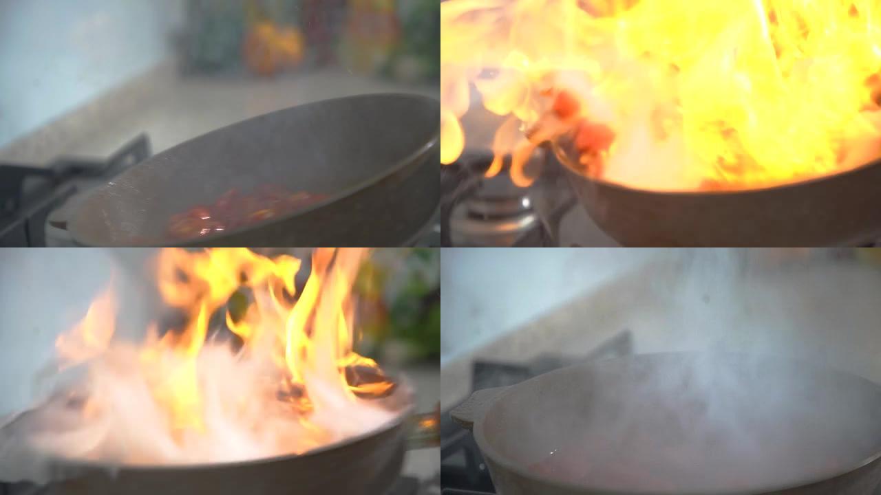 厨师混合油炸西红柿并制作flambe