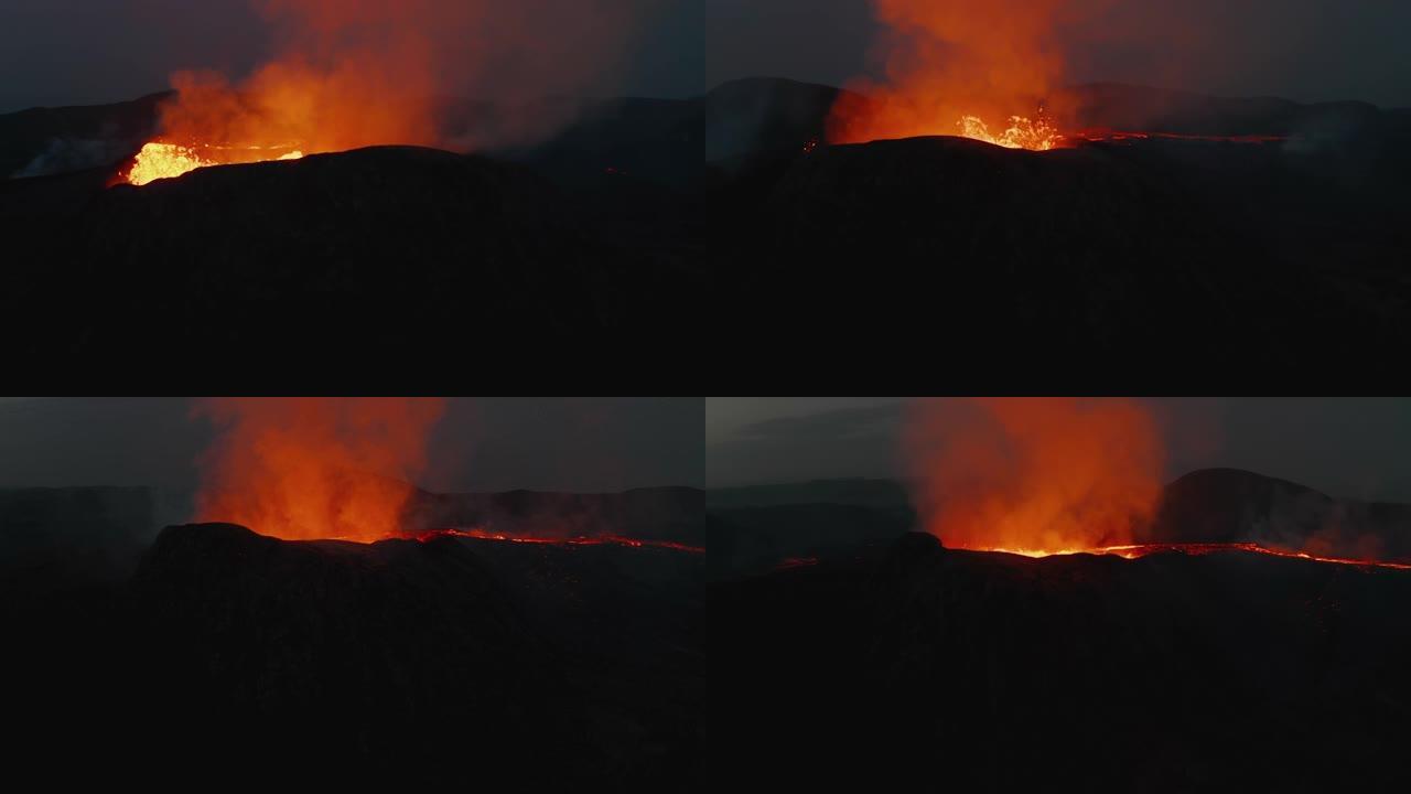 围绕活火山火山口拍摄的轨道。热沸腾的岩浆。反射光辉的流出火山气体。法格拉达尔斯福杰尔火山。冰岛，20