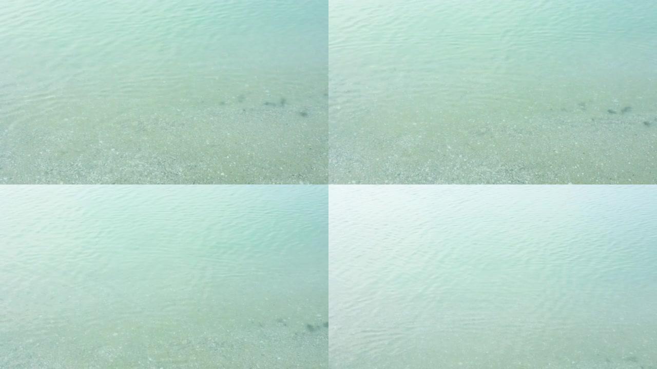 波涛汹涌的海面纹理。海洋主题与复制空间。俯视图海绿海水的自然背景。海蓝宝石海面的鸟瞰图。4k素材绿松