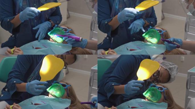 牙医在镜子里展示了治愈的牙齿。治疗牙齿的围堰