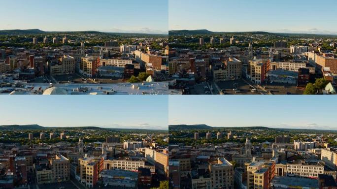 在一个阳光明媚的日子里，新泽西州的帕特森市包括了帕特森市议会。航拍视频与前进摄像机运动。