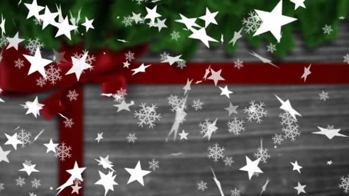 圣诞礼物上飘落的雪花和星星的动画