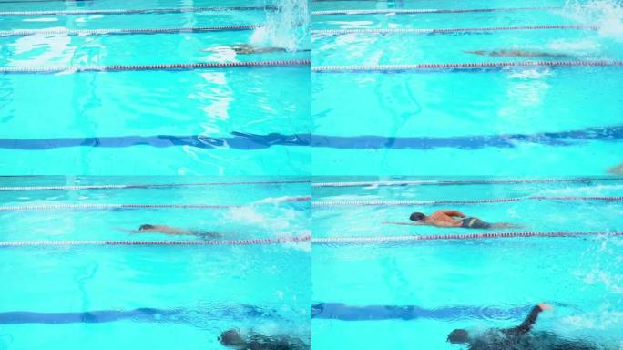 年轻人在比赛中游泳自由泳。