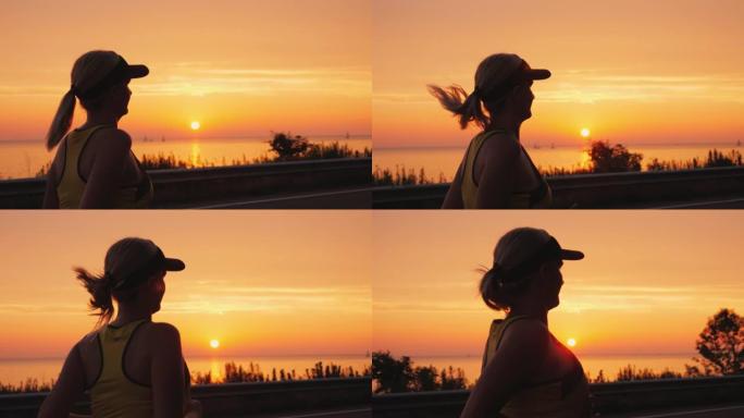 运动的年轻女子在太阳落山的海边慢跑。Steadicam射击