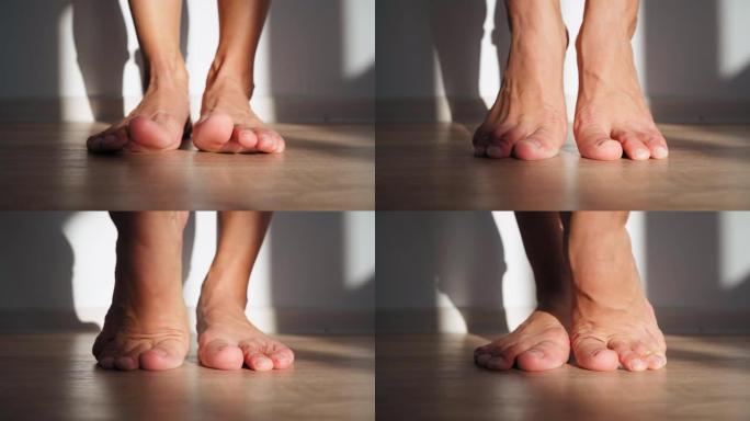 美丽的赤脚女性脚在明亮的阳光下。女人伸腿