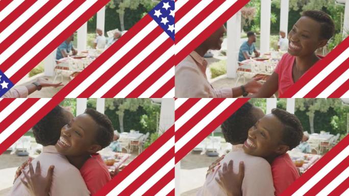 美国国旗的动画在两个微笑的妇女拥抱