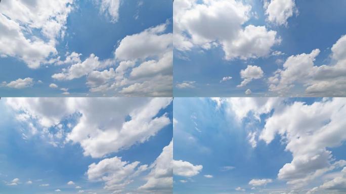 中午晴朗的蓝天与白色蓬松的云的时间流逝。白天。抽象的自然景观背景。