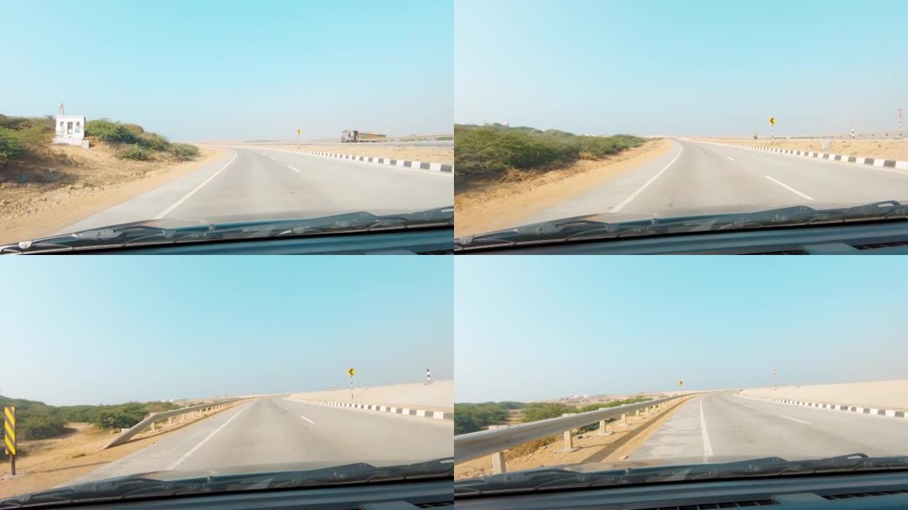 从汽车上看到蓝天空空的道路。道路4k视频。假日和旅行的概念