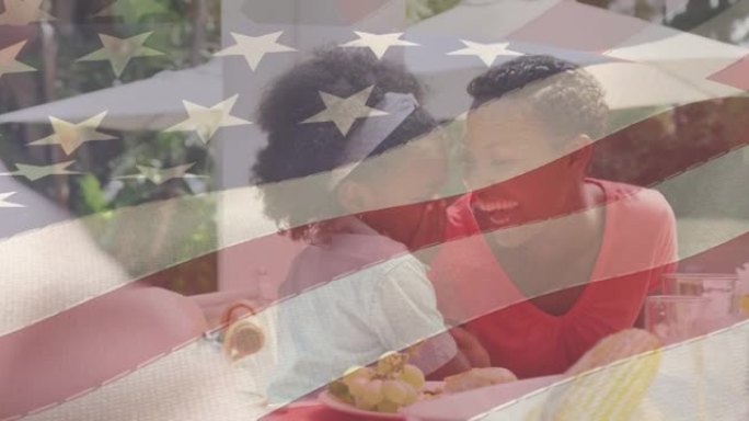 美国国旗在快乐的非裔美国人家庭共进晚餐和微笑的动画