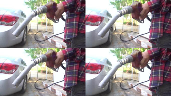 从汽油泵滴下的油加油枪特写视频素材