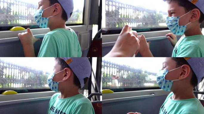 母亲在公共汽车上给孩子的手消毒