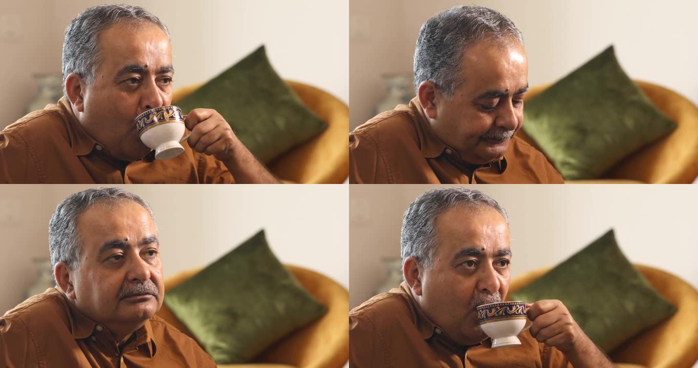 老人在家喝茶的肖像