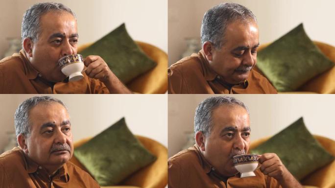 老人在家喝茶的肖像
