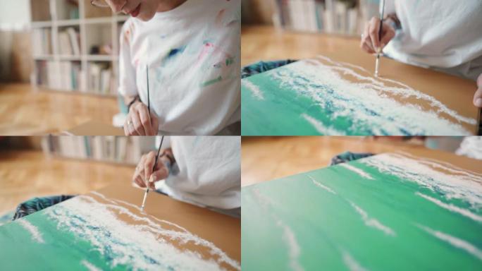 富有创造力的敬业女性艺术家，在她的现代家庭艺术工作室用油画在画布上绘画