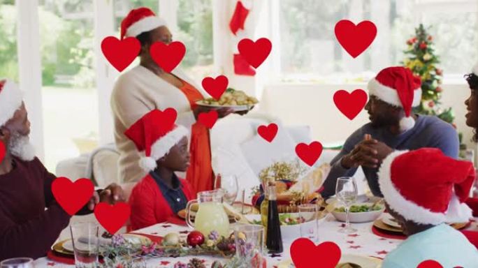 圣诞节晚餐期间，心脏在快乐的非裔美国人家庭上漂浮的动画