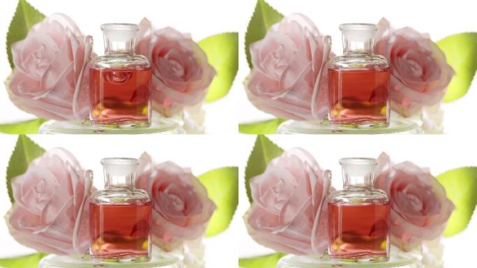 玫瑰花水滴落在玫瑰花前的试剂瓶中