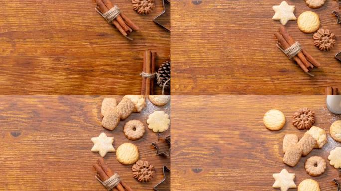 木制背景上的肉桂、饼干和松果圣诞装饰品的组成