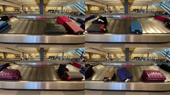 男子在机场的行李认领处从行李传送带上抓起行李