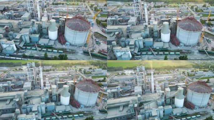 工业生产区高混凝土厂房结构水泥厂塔的鸟瞰图。制造业与全球产业概念。