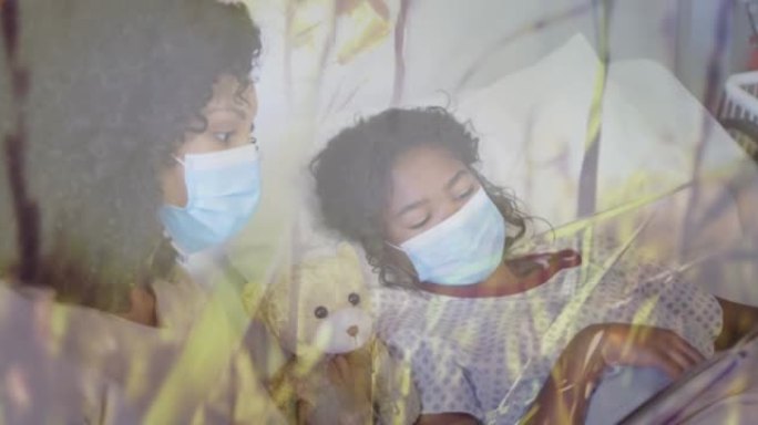 戴着口罩的混血儿母亲和女儿躺在医院的草的动画