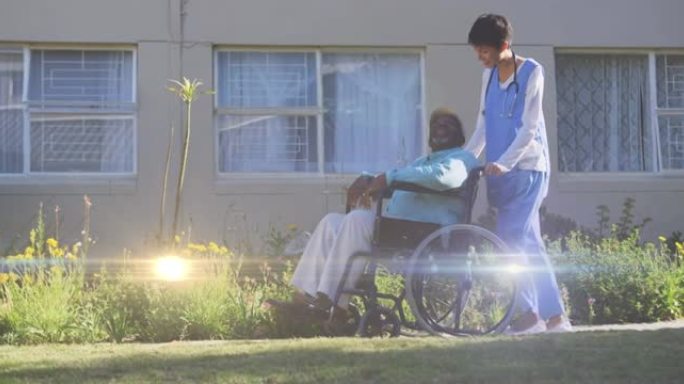灯光在轮椅上推着老人的女护士上方移动的动画