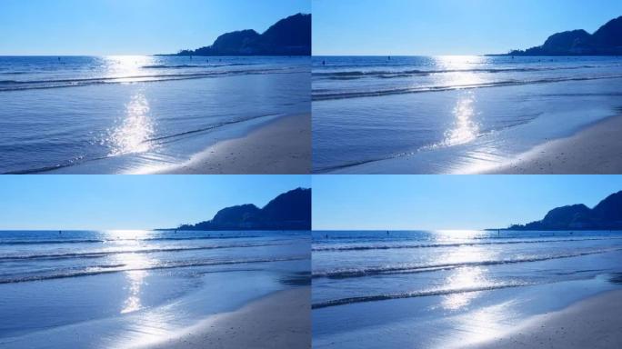阳光闪烁的海滩水天相接日出清晨蓝色海洋