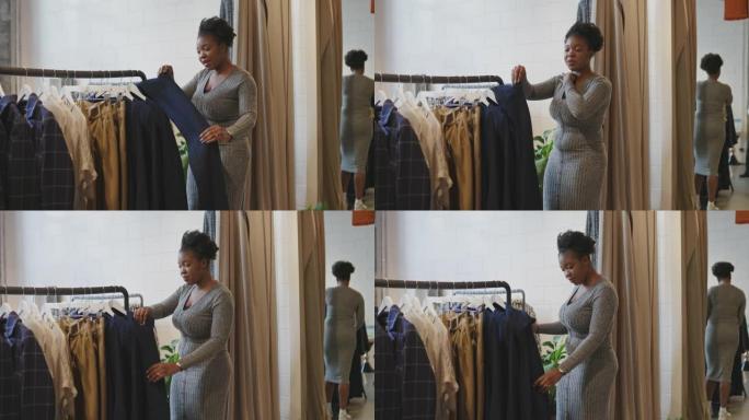 非洲妇女在商店尝试新衣服