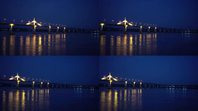 泰国老挝湄公河上的寄宿生桥在大流行期间夜景中的美丽反射，半灯点亮
