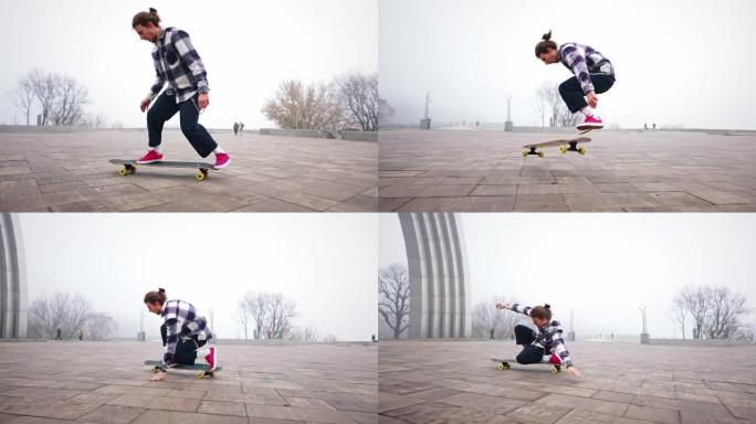 这家伙正在城市公园里骑长板。自由式滑板风格。在空中跳跃和翻转溜冰鞋。用手保持平衡。慢动作，子弹时间