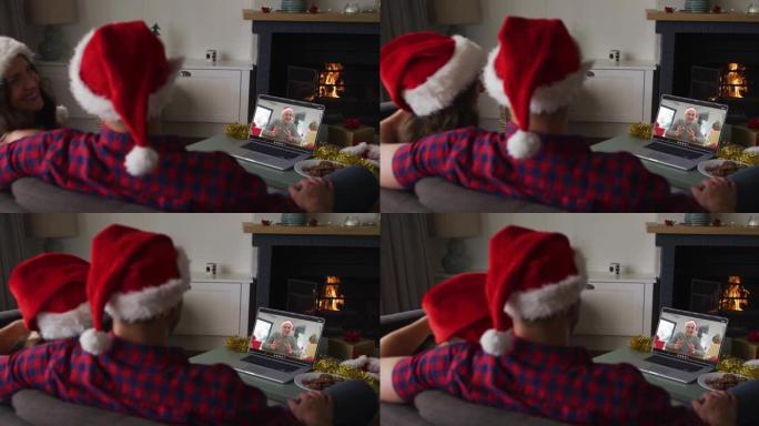 圣诞节时，高加索夫妇与祖父在笔记本电脑上进行视频通话