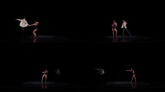 年轻的交际舞情侣在黑暗的舞台上跳舞拉丁美洲节目舞蹈，臀部旋转，舞步，同步动作。表演或比赛准备概念，交