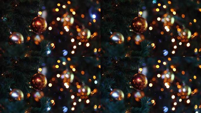 圣诞灯笼中圣诞树上的光滑橙色球