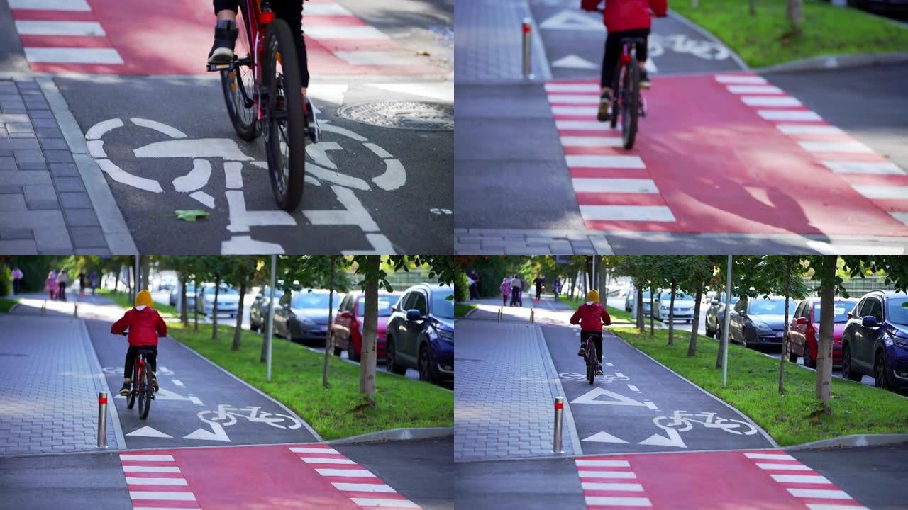 一个骑着红色自行车的男孩沿着自行车道骑行。骑自行车。自行车标志。