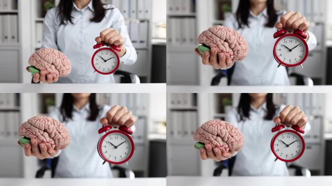 女人手持红色闹钟和人造大脑模型4k电影慢动作
