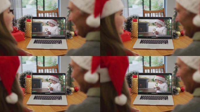 圣诞节时，高加索人的孙女和祖父与孙子进行视频通话
