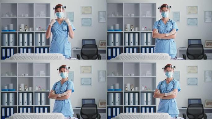 年轻的女兽医戴着医用口罩和防护罩的肖像，站在医生办公室看着相机时，自信地将双臂交叉在胸前