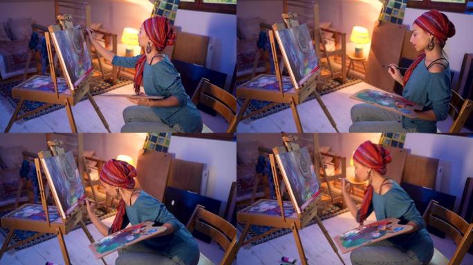 从她舒适的工作室，城市高加索女性艺术家，在画布上绘画
