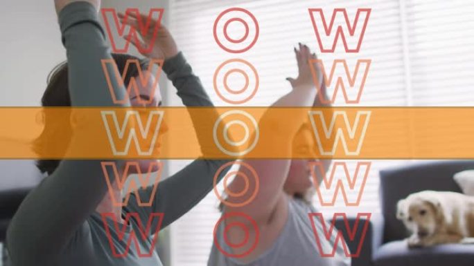 wow文本橙色的动画超过两个白人妇女在家做瑜伽