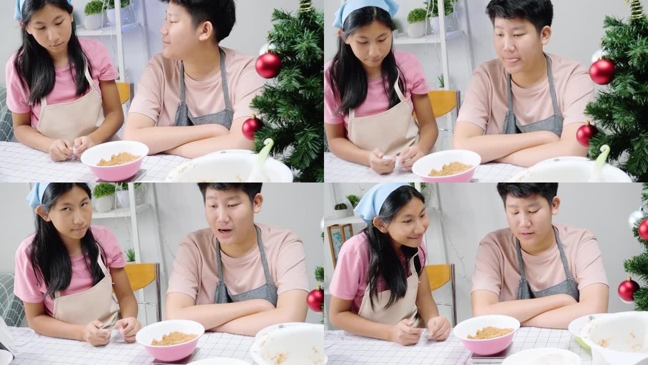 亚洲儿童在家一起烤圣诞饼干前测量面粉，生活方式理念。