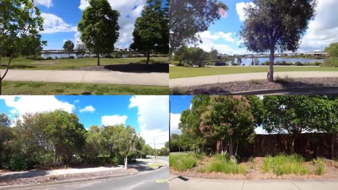 在新建立的澳大利亚中上阶层沿海郊区的早晨开车。公共空间、湖栅栏、远处的房子和环形交叉路口。侧视图。