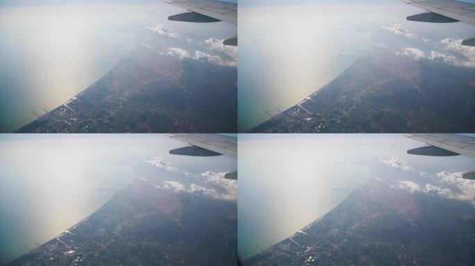 晴天旅行时间飞机窗口pov海岸线全景4k印度尼西亚