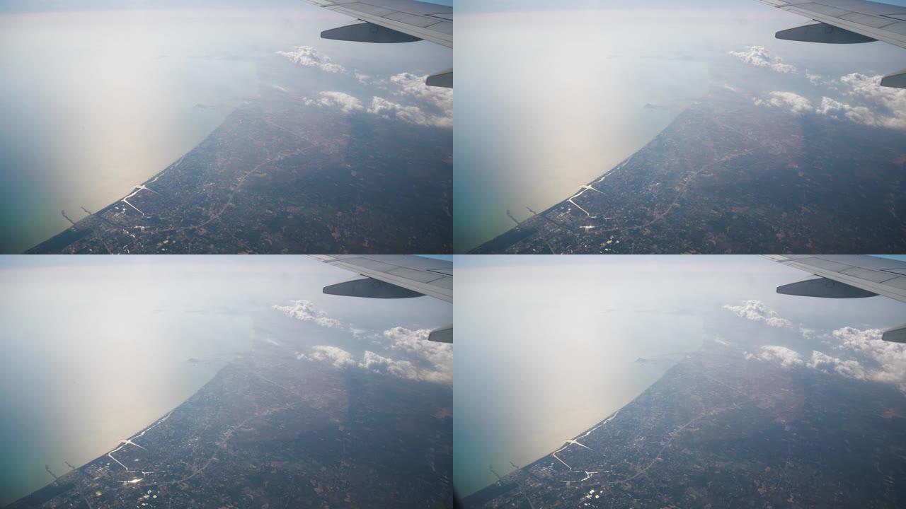 晴天旅行时间飞机窗口pov海岸线全景4k印度尼西亚