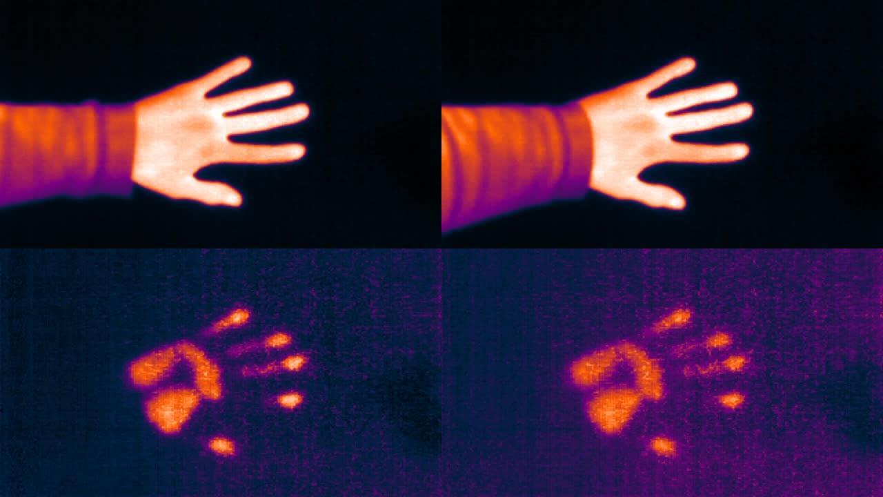紫外光谱热像仪检测手温。手在墙上留下了一个热标。热成像概念