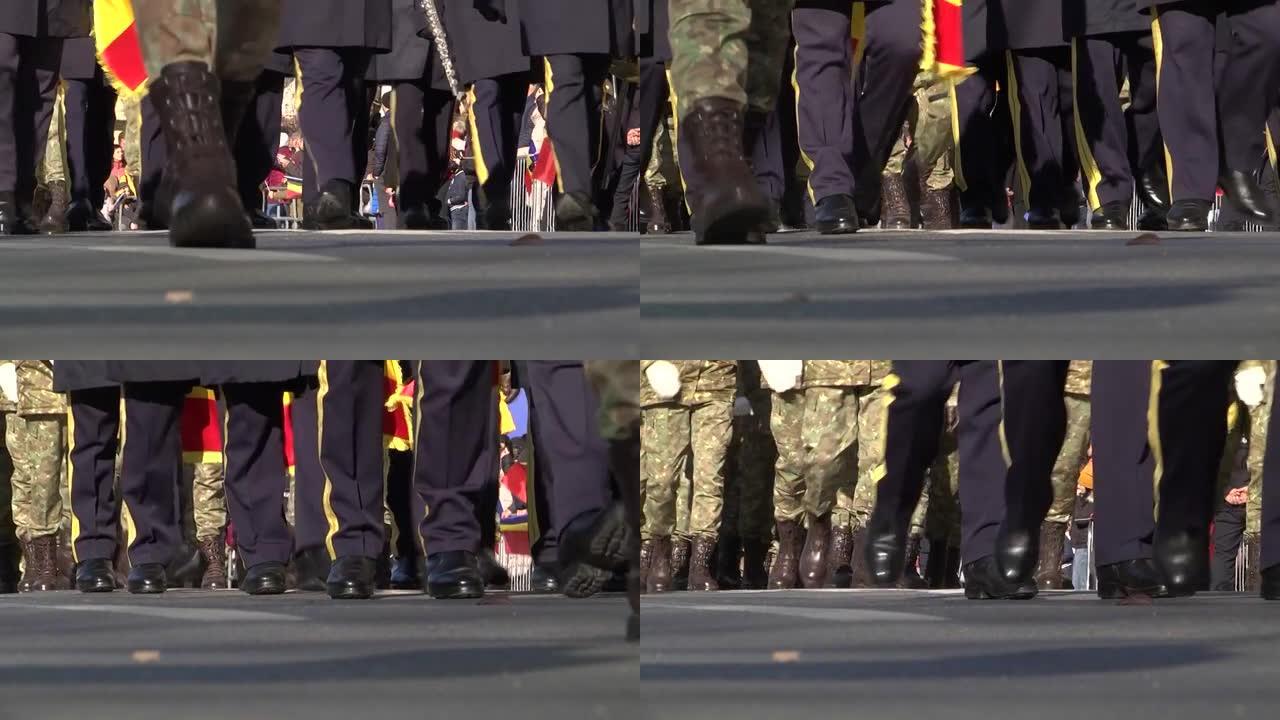 在一座大城市的林荫大道上举行的阅兵式上，士兵和毕业生的腿在行进，而观众则在观看挥舞的国旗