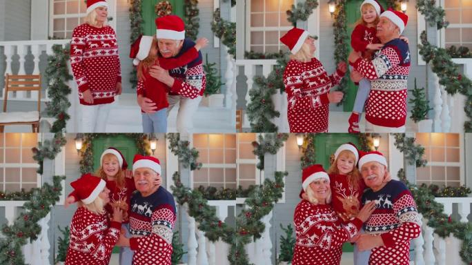 快乐的女孩孙女遇见她可爱的祖父母，拥抱，拥抱在圣诞节的家中